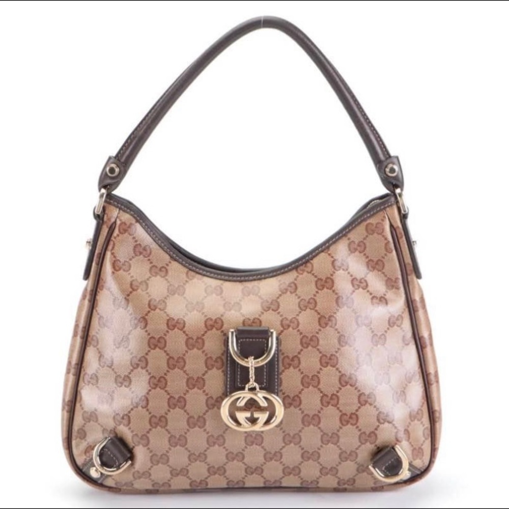 Gucci Abbey small hobo shoulder bag in GG crystal canvas and dark brown leather.